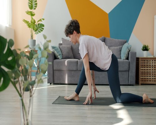 Person doing light stretching in a living room