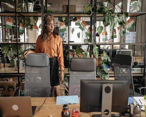 Person standing up from a desk chair